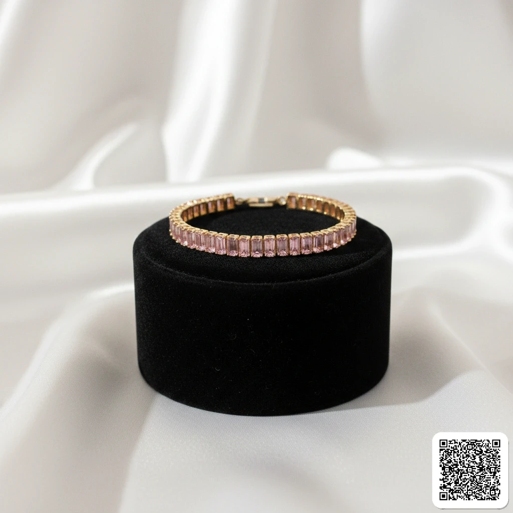 Elegantes Tennisarmband Mit Rosa Baguette-Zirkonia Goldfarben Hover