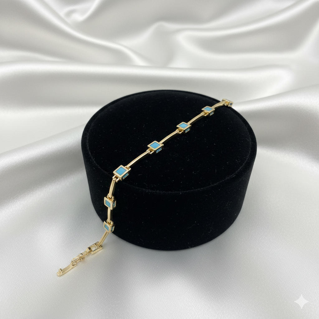 Elegantes Goldfarbenes Armband Mit Türkisen Quadratischen Steinen